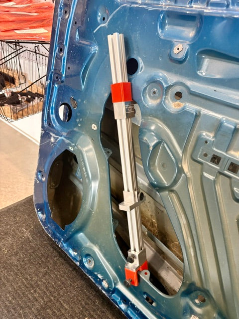 Door leverage bar for PDR – full-length view with sliding stands
