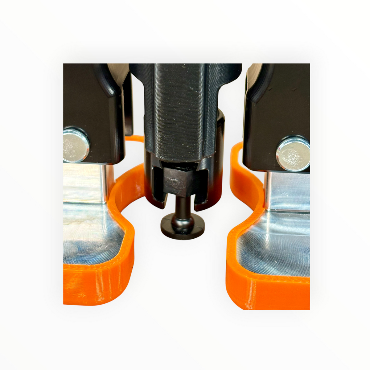 M-Lifter Tab Trap installed around the puller shaft with a black round pulling tab