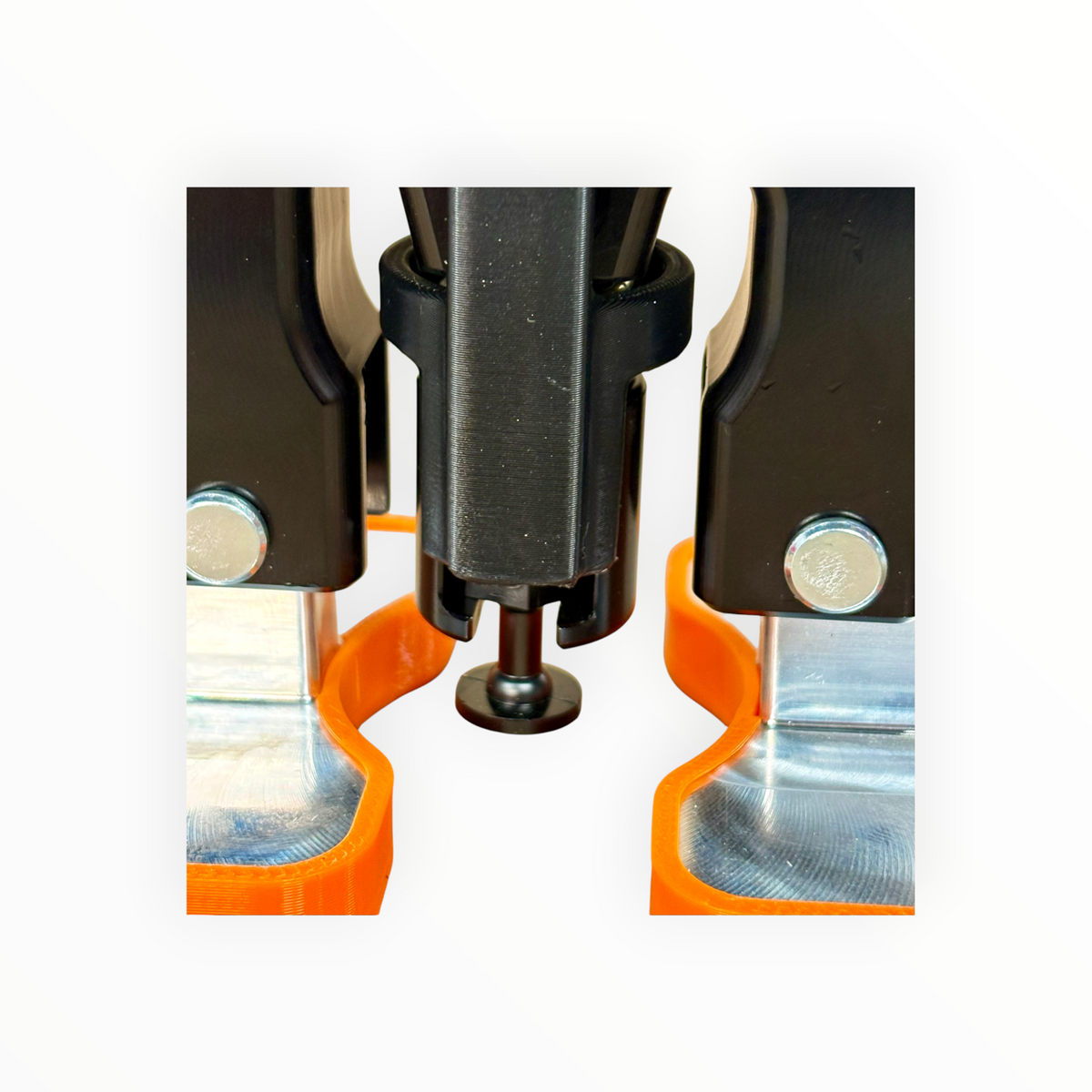 Close-up of the mounted M-Lifter Tab Trap and black pulling tab beneath the puller shaft.