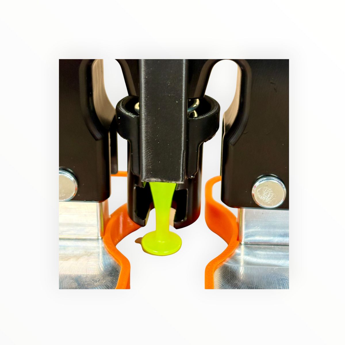 Front close-up of the M-Lifter Tab Trap surrounding a green pulling tab beneath the puller shaft.