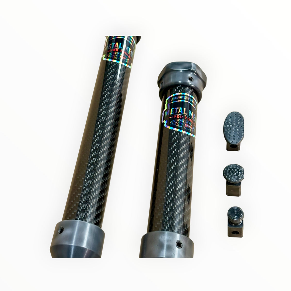 Metal Medic carbon fiber slide hammer bodies beside oval and round cold glue tabs.